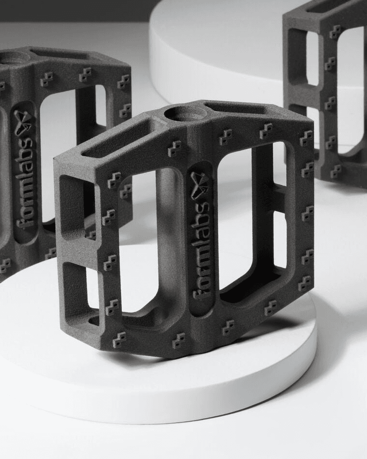 Bicycle pedals printed in SLS PA12 on light display stands