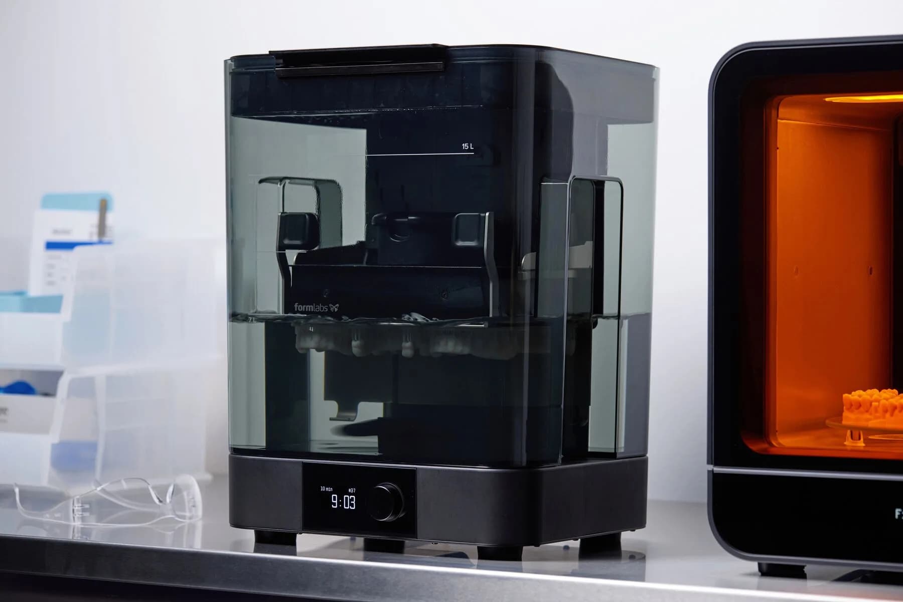 Form Wash L and Form Cure L standing side by side on the workshop table