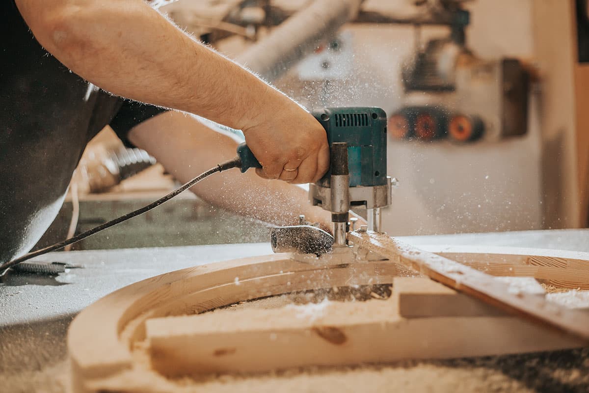 Carpenter working on a wooden furniture component