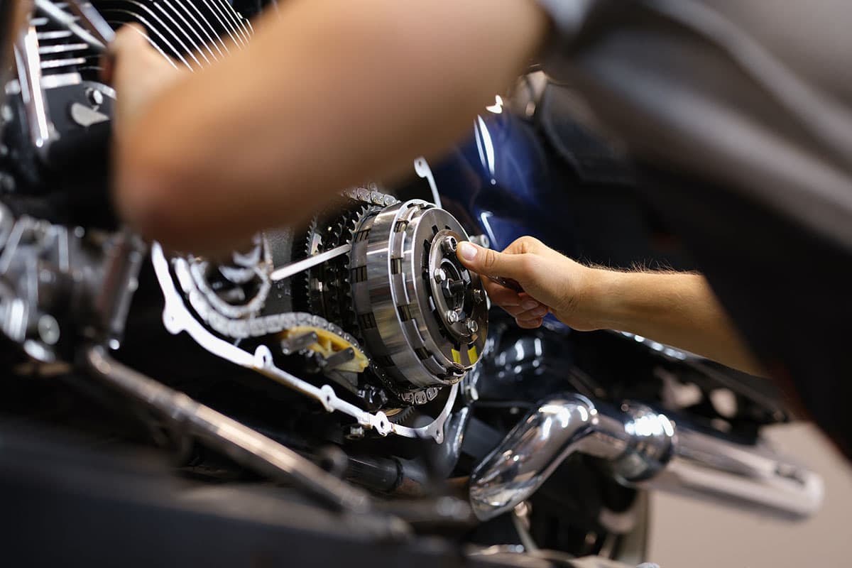 Mechanic working on a motorcycle engine