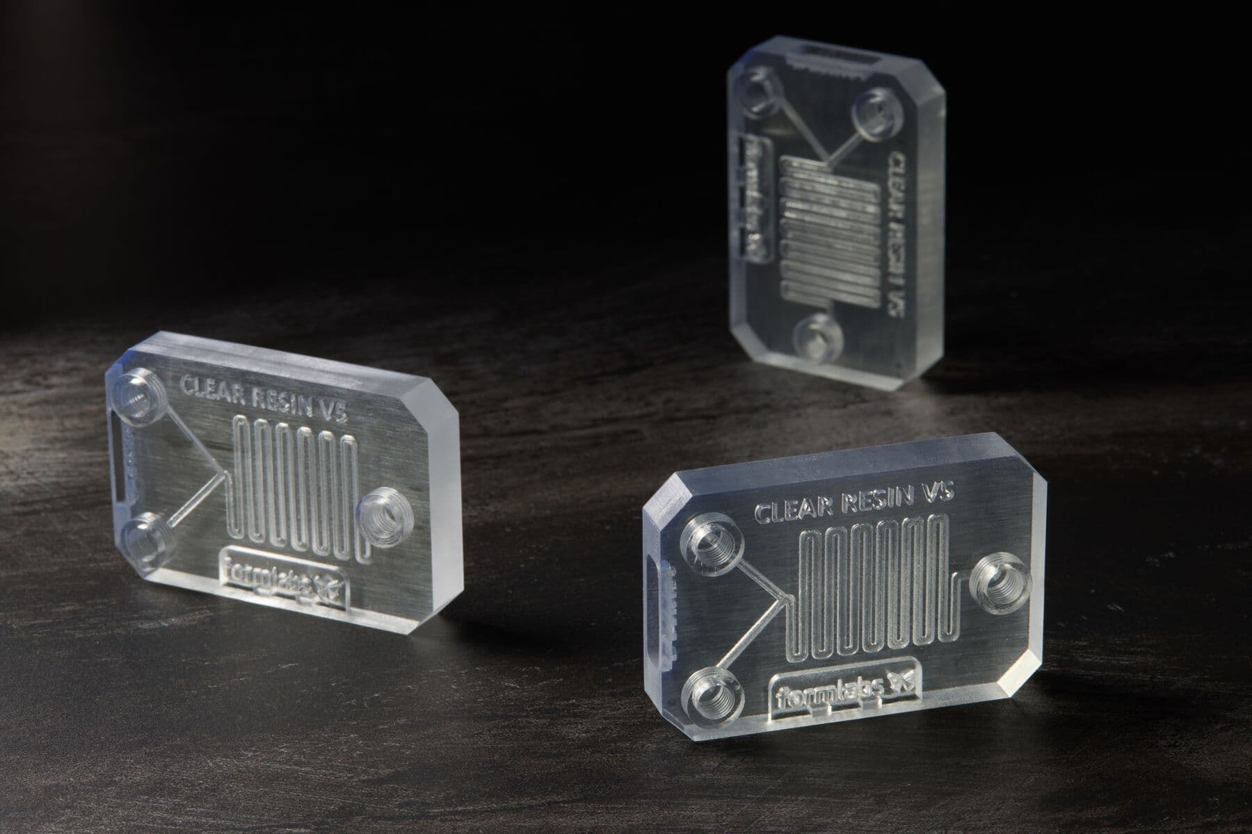 Transparent Clear Resin V5 samples on a dark surface