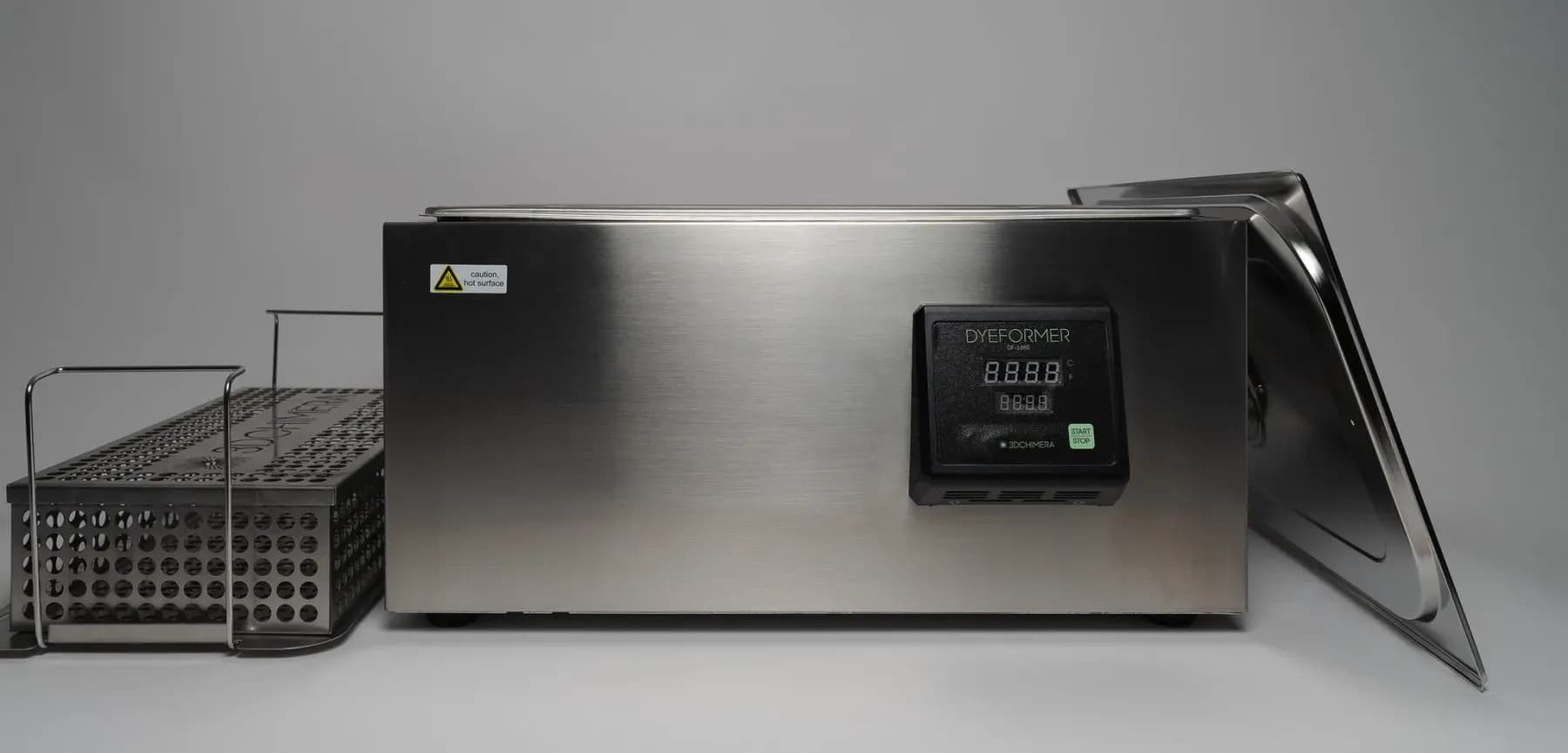 Dyeformer DF-1680 steel dyeing tank with a control panel and a parts basket beside it.